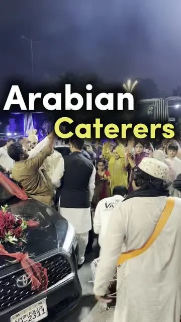 Arabian Caterers serving at an event